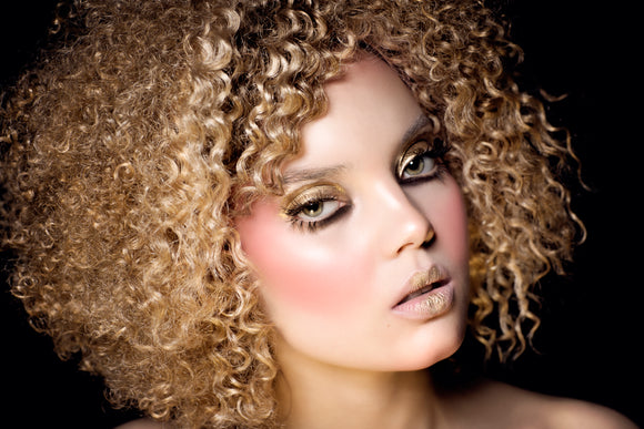 Gold Metallic powder accents on a models face